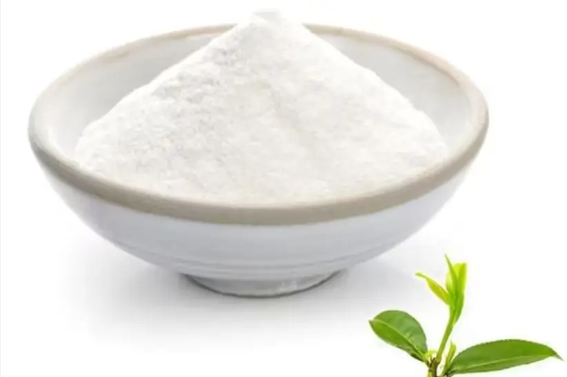 Green tea leaves on a white background